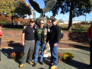 Shawn Gallagher (L) poses with fellow Marines Richard Watson (C) and Tim McVay (R)